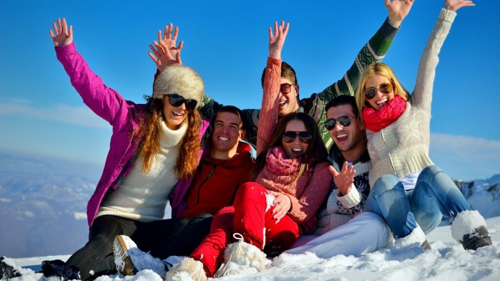 group of friends enjoying the snow