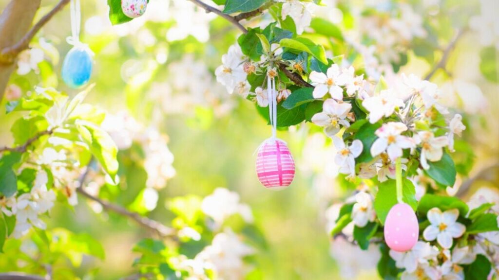 pastel Easter eggs on spring blossom tree