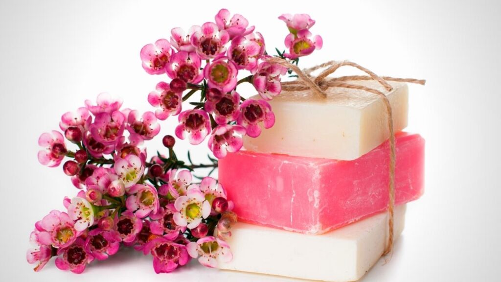 white and pink bars of handmade soaps with cherry blossom flower