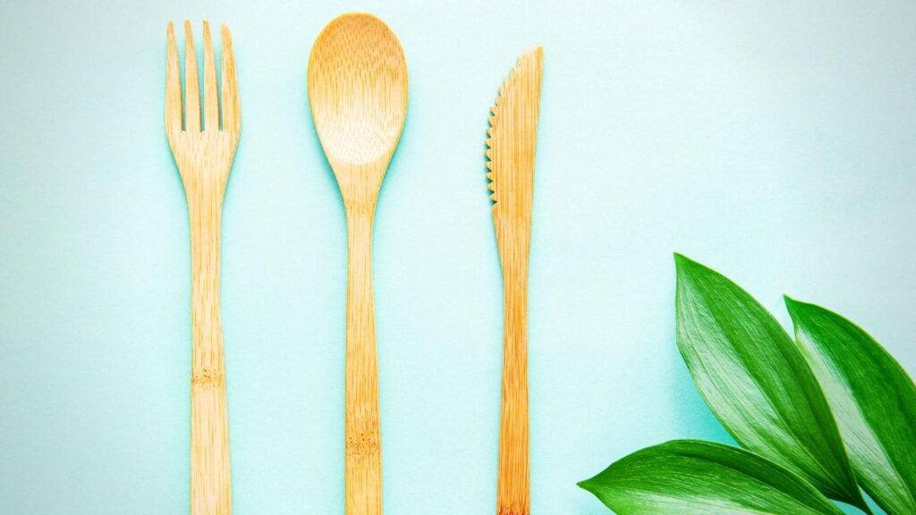 bamboo cutlery set on pale blue background