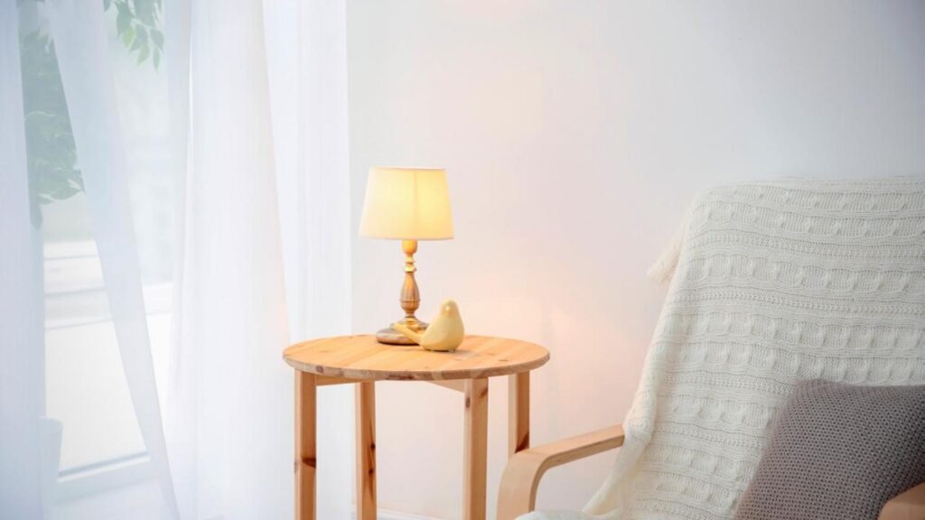 lamp on small wooden table with white background