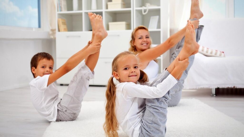 mother and children doing morning stretches