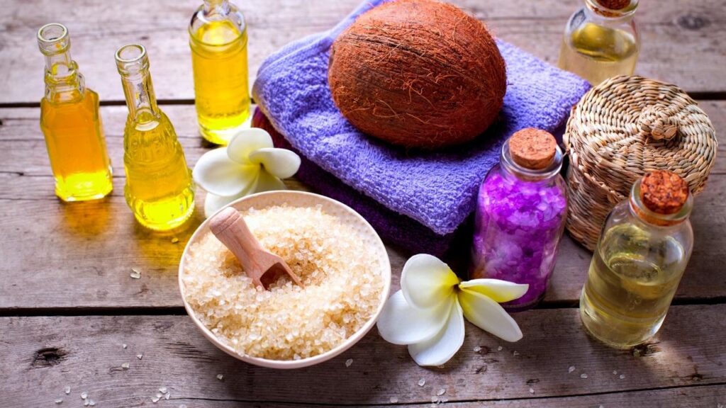 coconut, essential oils and bowl of sea salt