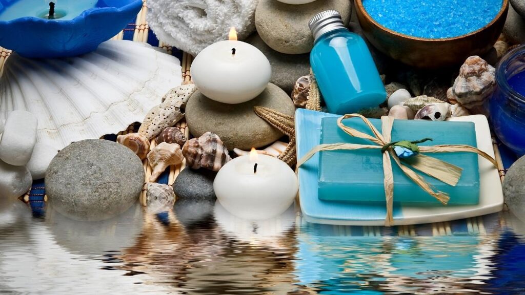 blue and white spa ingredients beside water