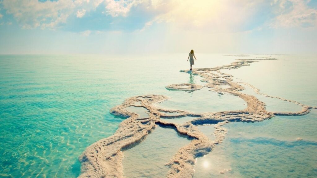 girl walking on the waters of the Dead Sea