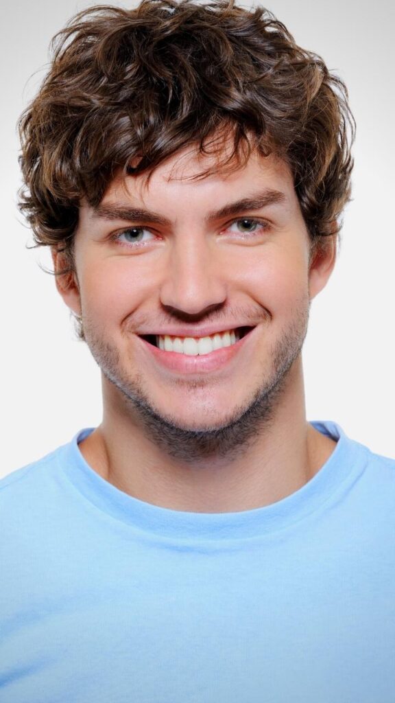 portrait of man with healthy strong hair and teeth