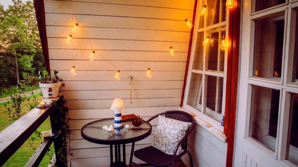 table on balcony with lighthouse decoration