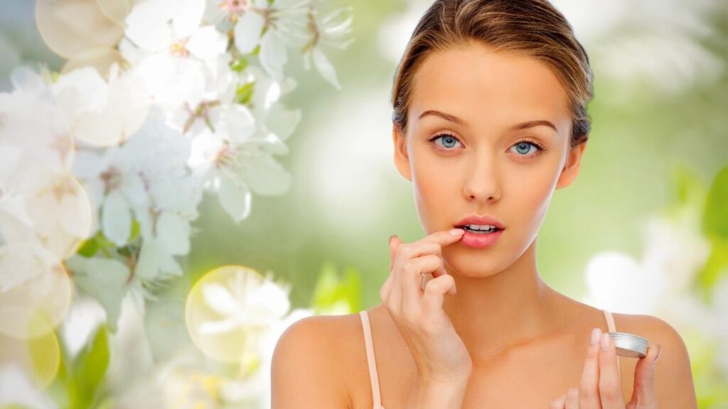 young girl applying lip balm