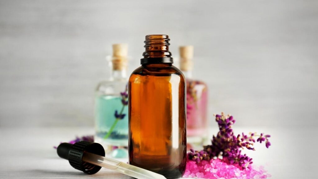 glass skincare bottles with lavender flowers