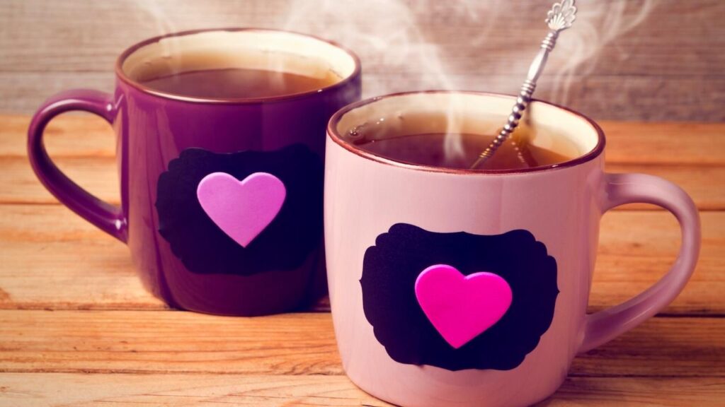 2 mugs of redbush tea with heart designs
