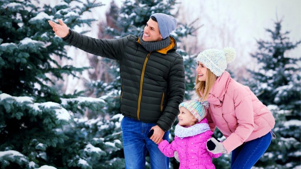 young family in winter woods