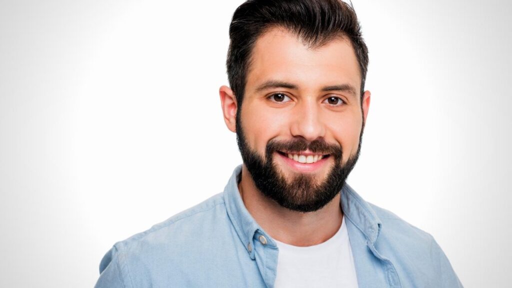 happy young man with tidy beard