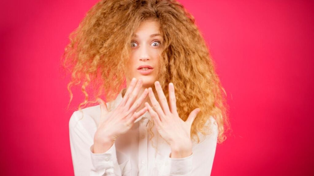 startled woman with frizzy hair style