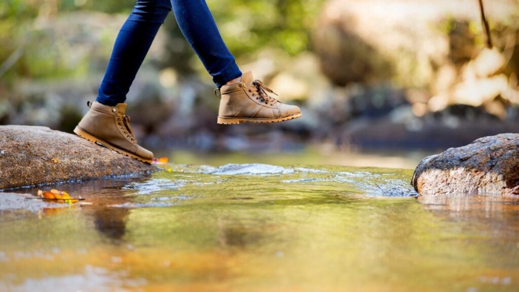 woman's feet stepping across water