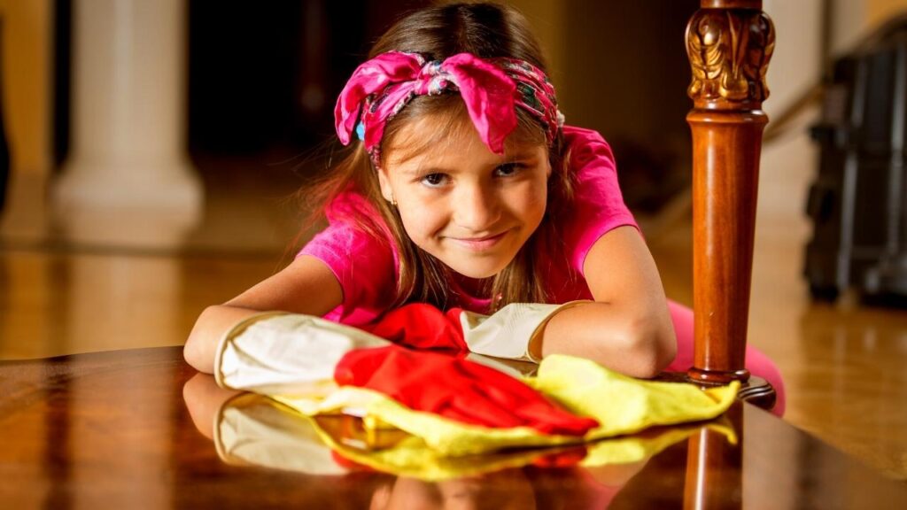 young girl polishing table