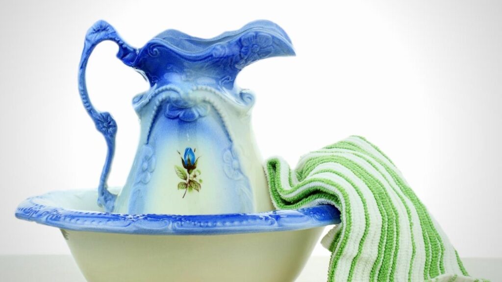 blue water jug, bowl and stripy green towel