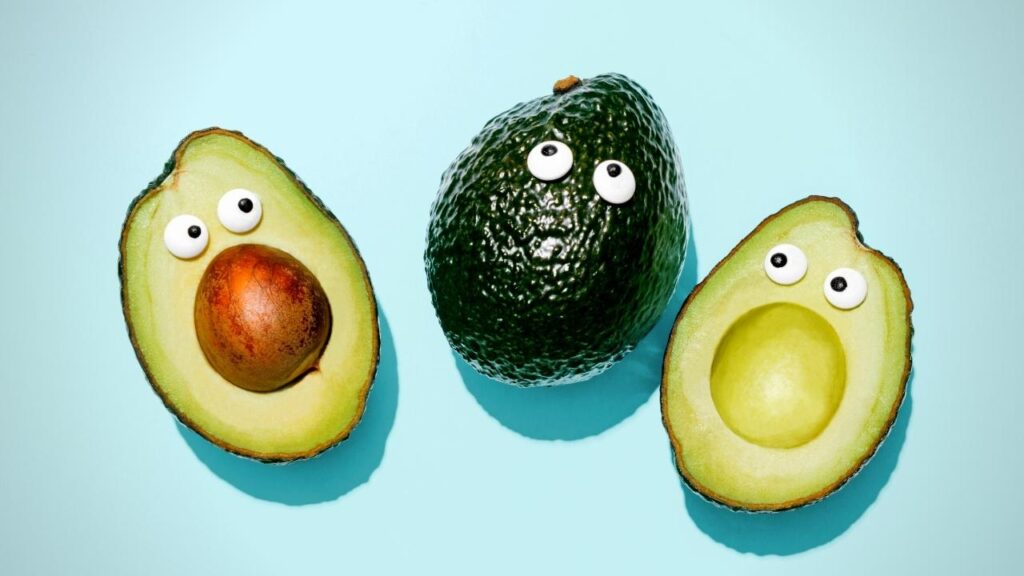 3 avocado halves with faces