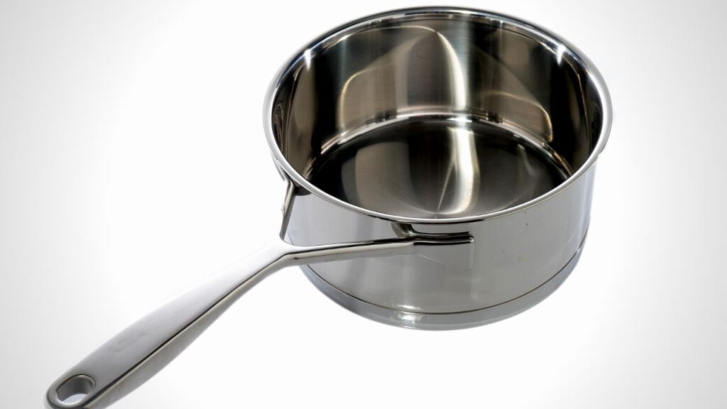 stainless steel pan with wishbone handle on white background