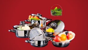 stainless steel cookware set on red background