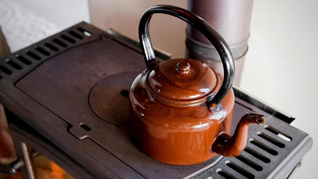 traditional brown kettle on stove top