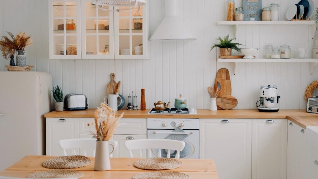 white kitchen with autumn flower displays
