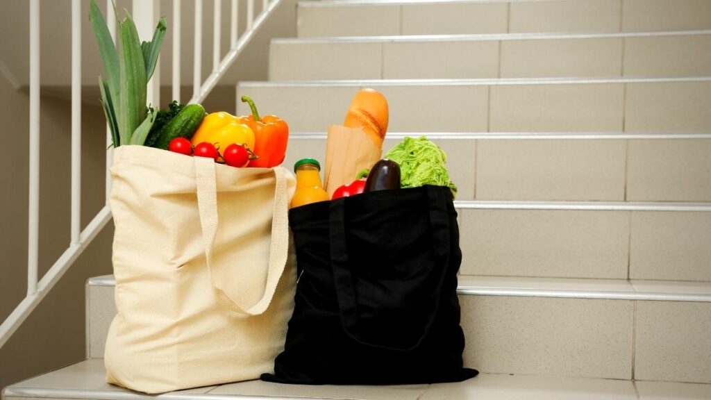 2 bags of produce on stairs