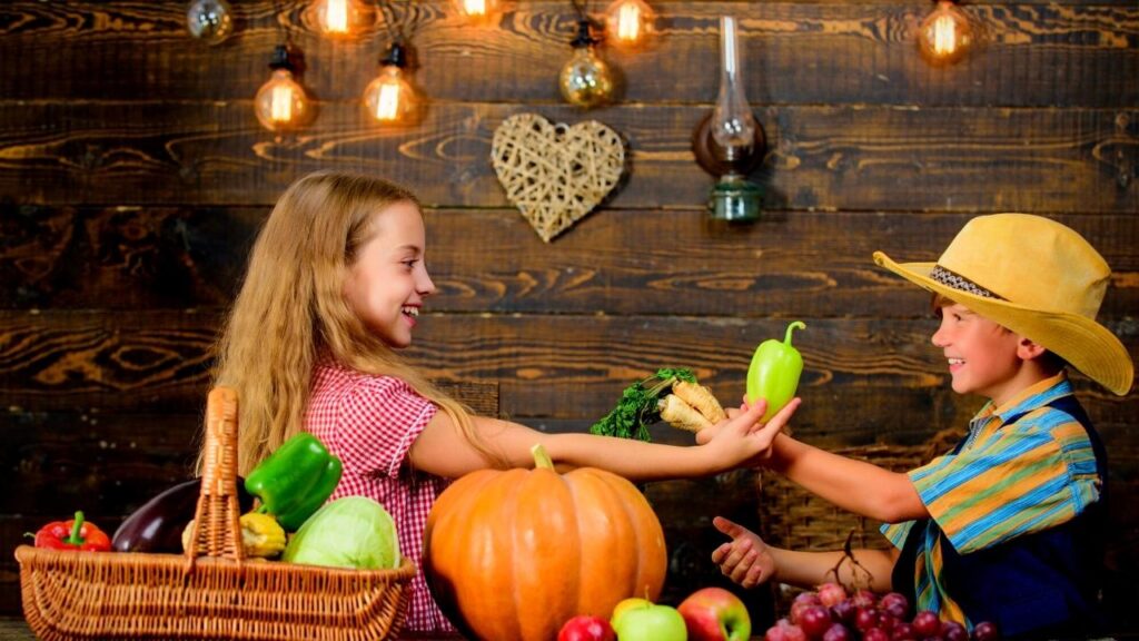 girl and boy swapping produce