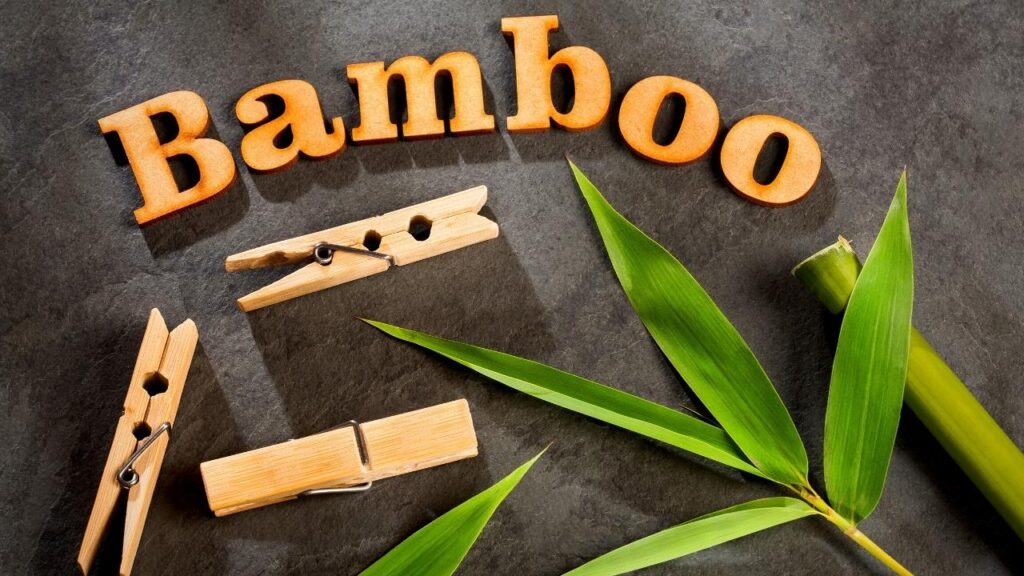 bamboo letters beside clothes begs