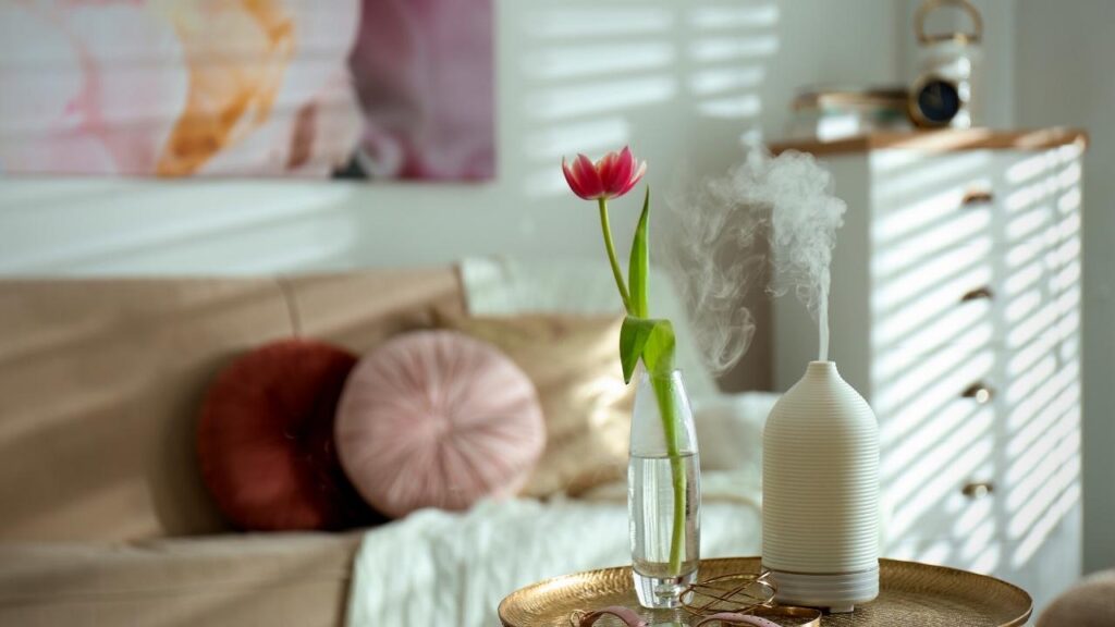 diffuser on table beside flower