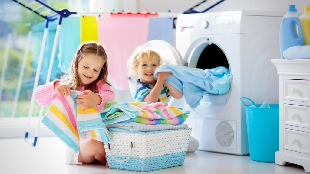 girl and boy playing with washing