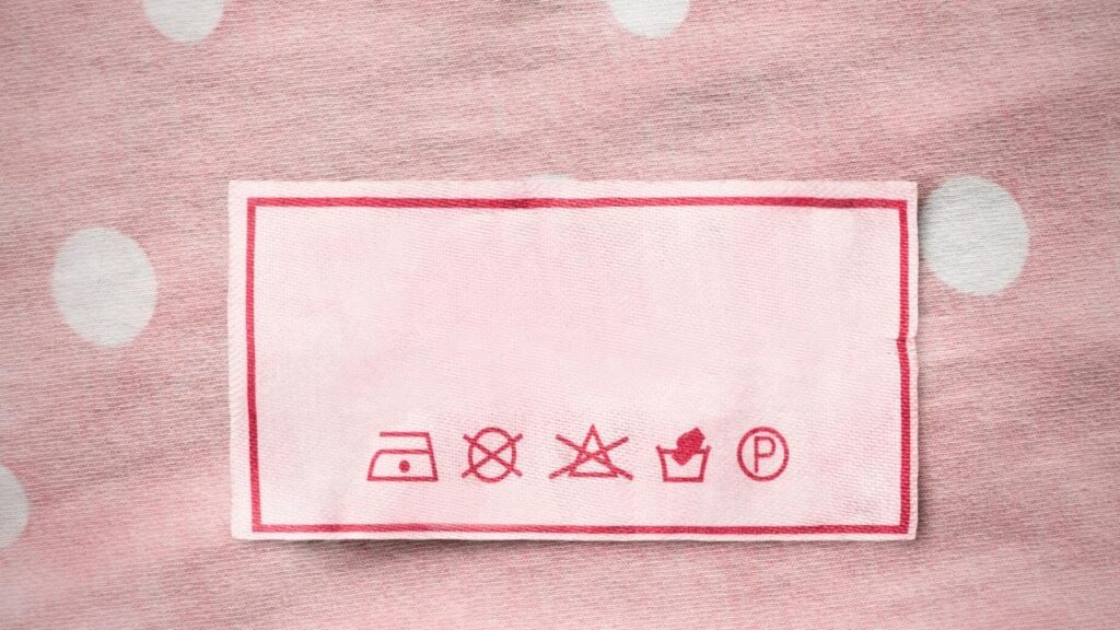 wash symbols on pink clothes label 