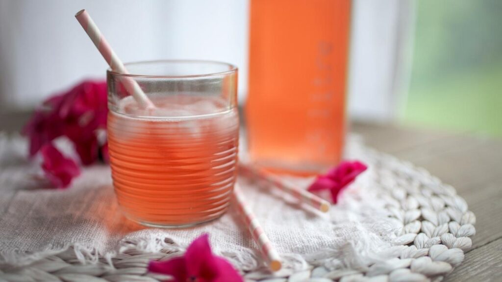 glass of rhubarb juice with straw